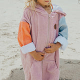 Detail view of child wearing CRYWOLF Everywhere Zip-Up Towel - Sunset Colour Block