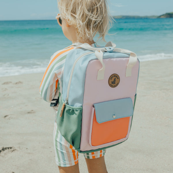 CHILD AT BEACH WEARING CRYWOLF Mini Backpack - Sunset Colour Block