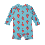 Back view of children's swimsuit with red lobster pattern on a blue background