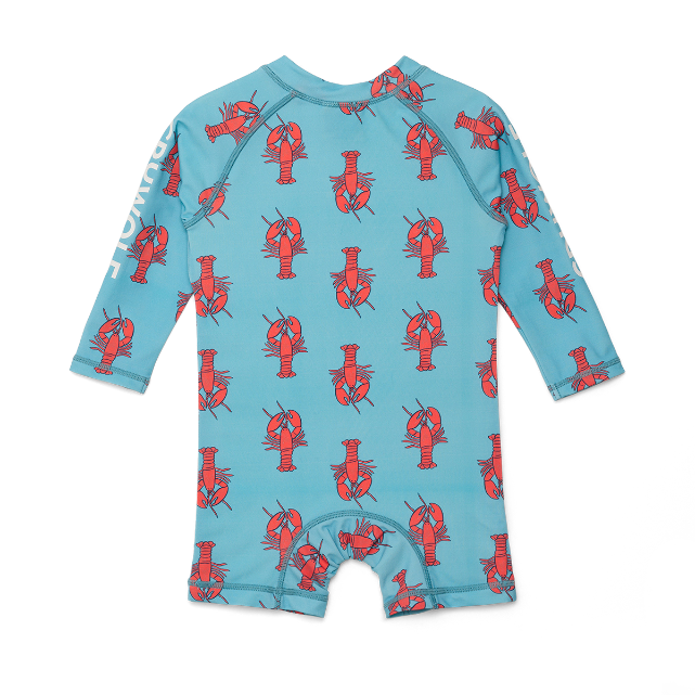 Back view of children's swimsuit with red lobster pattern on a blue background