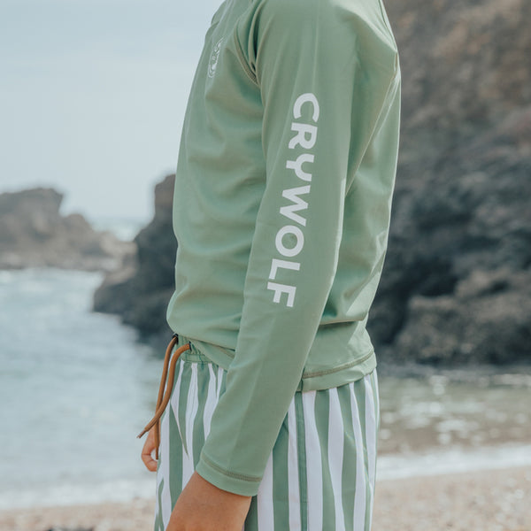 Side view of Crywolf logo on the CRYWOLF Rash Vest - Coastal Green