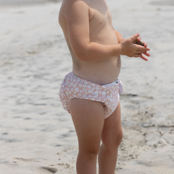 Side view of child wearing CRYWOLF Reusable Swim Nappy - Ditsy Floral