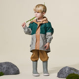 Studio shot of child wearing CRYWOLF Explorer Jacket Moss Forest and Moss Rain Boots