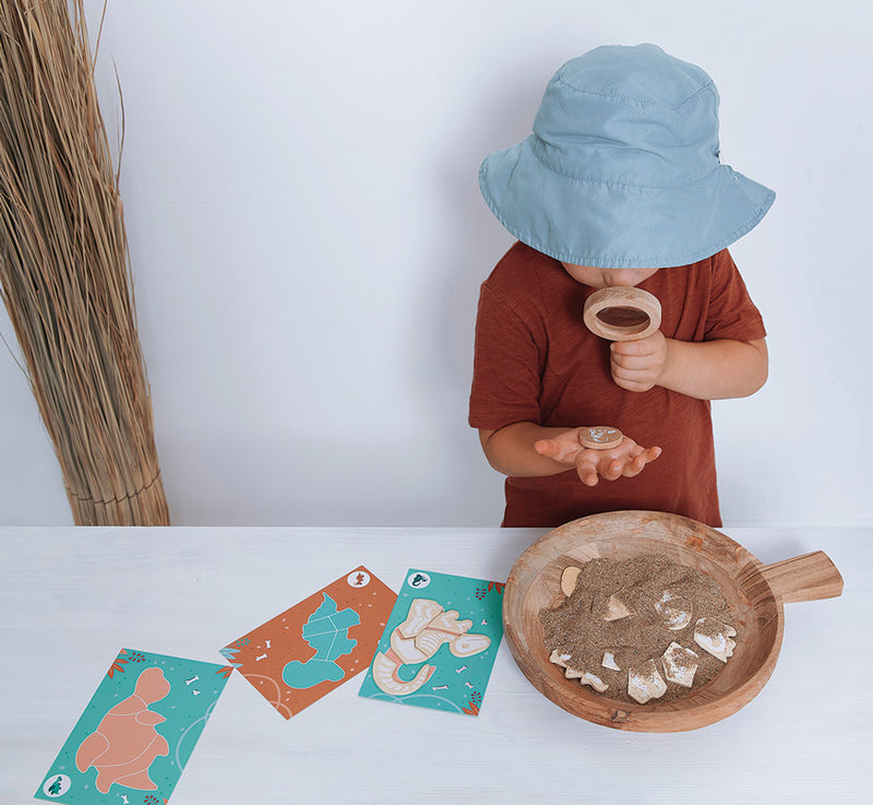 Child playing with the JANOD Dino Dig Game