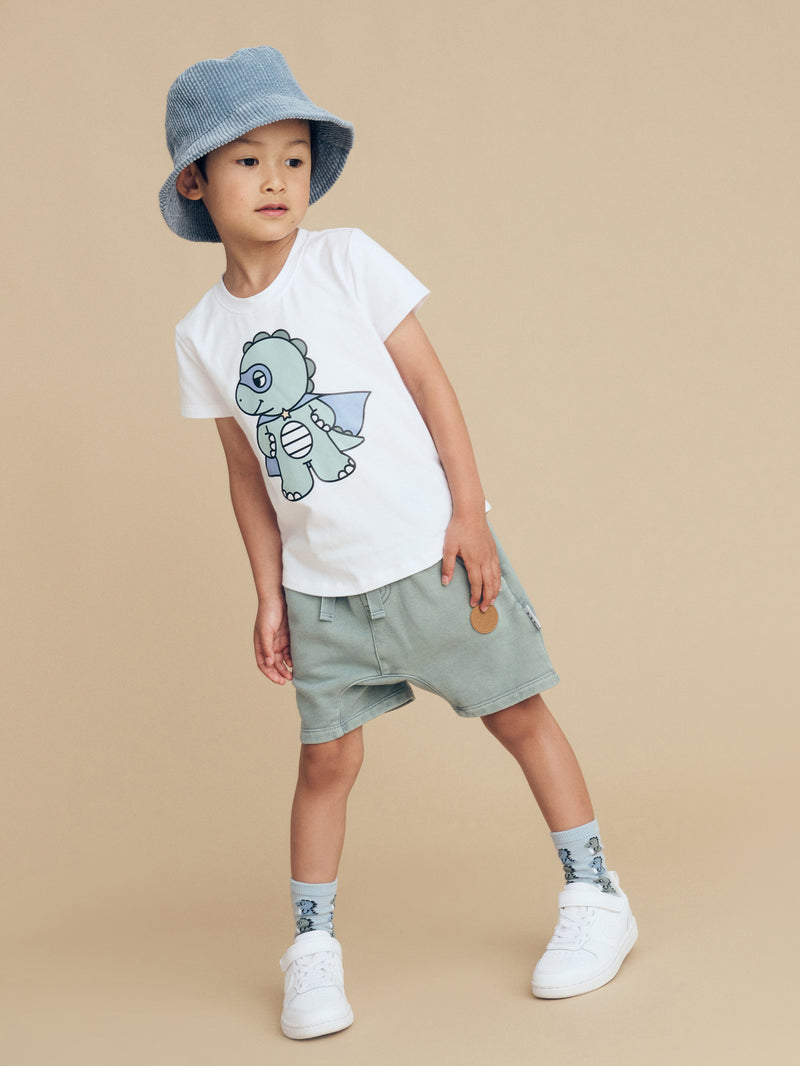 Child wearing the HUXBABY Dino Hero T-Shirt and Vintage Slate shorts