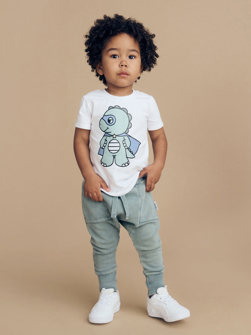 Child wearing the HUXBABY Dino Hero T-Shirt and Vintage Slate trackpants
