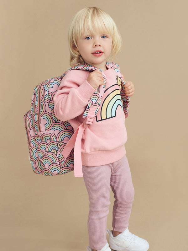Child wearing the HUXBABY Sunrise Backpack