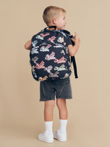 Child wearing the HUXBABY Super Dino Backpack back view