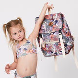 Child holding the CRYWOLF Knapsack - Tropical Floral