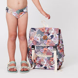 Child standing next to CRYWOLF Knapsack - Tropical Floral