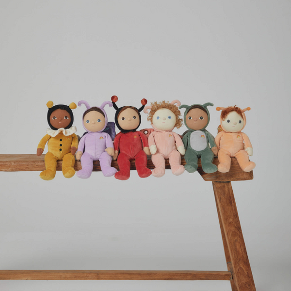 All six backyard buddies sitting on a wooden bench.  From left to right: yellow bumblebee, purple butterfly, red ladybug, pink moth, green grasshopper and orange snail
