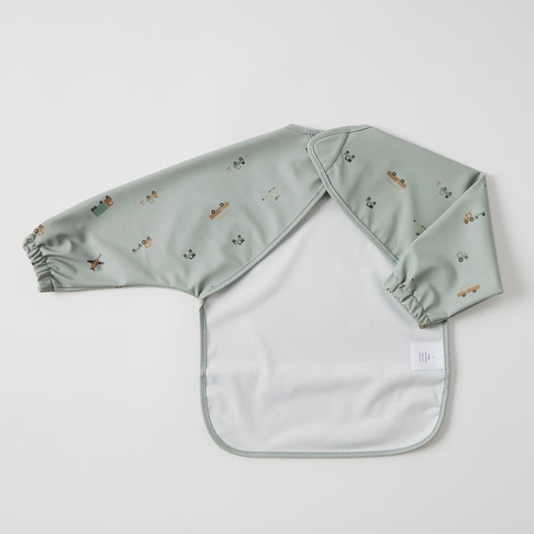 Back of Light green baby bib with pattern on a white background