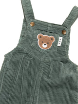 Detail view of Huxbear patch on the HUXBABY Light Spruce Cord Overalls