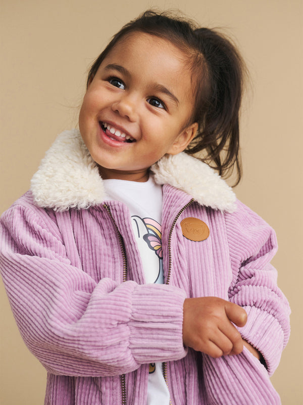 Child wearing the HUXBABY Orchid 80's Cord Jacket