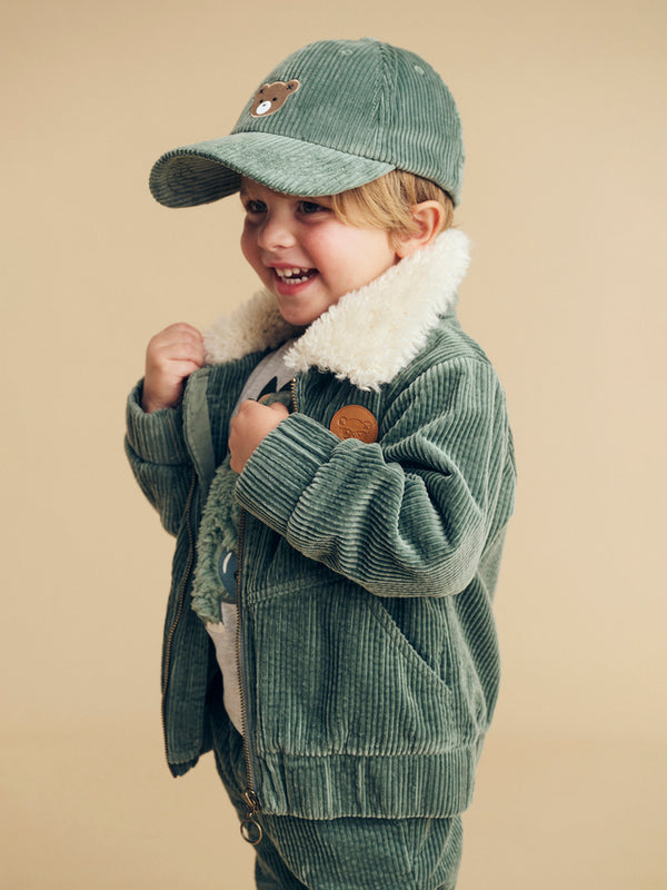 Child wearing the HUXBABY Light Spruce 80's Cord Jacket
