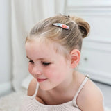 Child wearing JOSIE JOAN'S Little Penny Hair Clips - Limited Edition