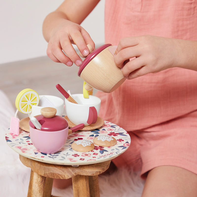 Child playing with JANOD Tea Set