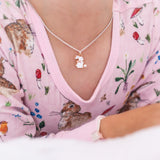 Girl wearing LAUREN HINKLEY Bunny Necklace