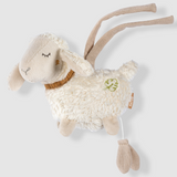 Plush toy sheep with brown accents on a light gray background