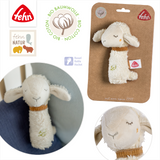 Plush lamb toy with packaging and branding on a white background
