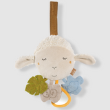 Plush toy lamb with leaf and butterfly on a white background
