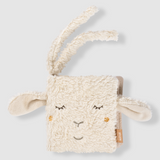 Plush toy with sheep ears and face on a light grey background