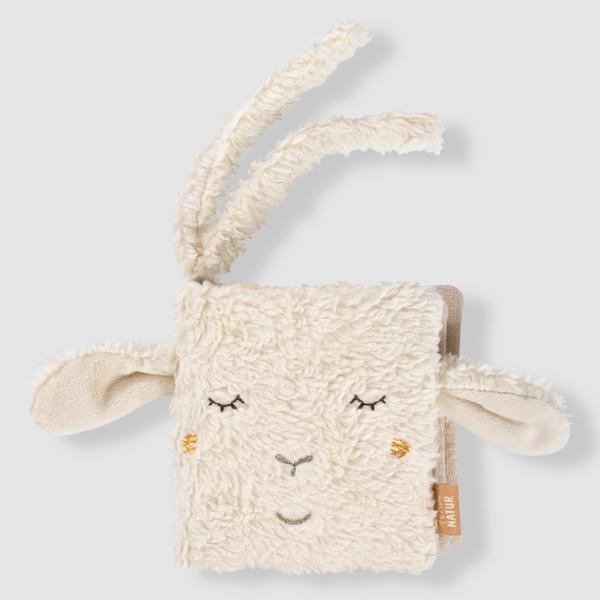Plush toy with sheep ears and face on a light grey background