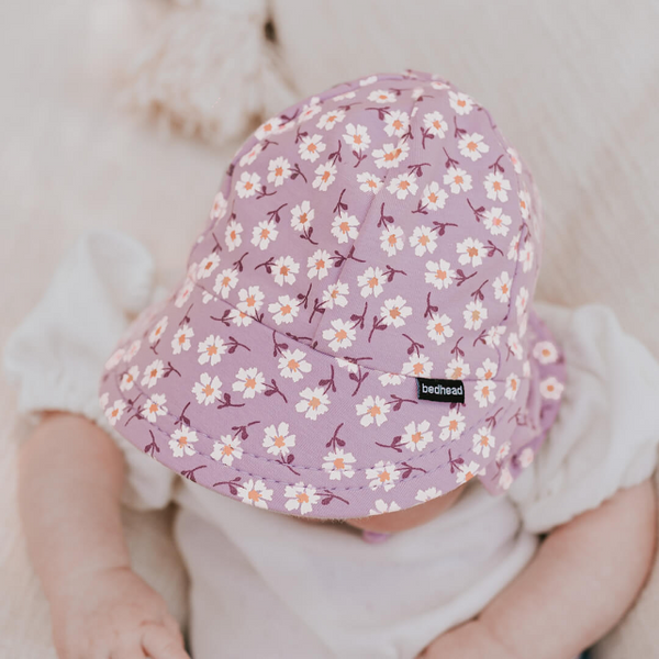 Top view of baby wearing BEDHEAD HATS Legionnaire Flap Sun Hat - Lana