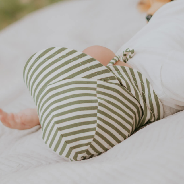 Top view of baby wearing BEDHEAD HATS Legionnaire Flap Sun Hat - Khaki Stripe