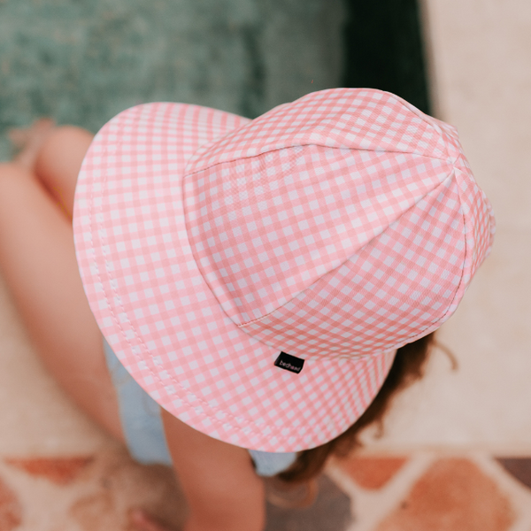 Top view of girl wearing BEDHEAD HATS Ponytail Swim Bucket Beach Hat - Skipper