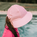 Side view of girl wearing BEDHEAD HATS Ponytail Swim Bucket Beach Hat - Skipper