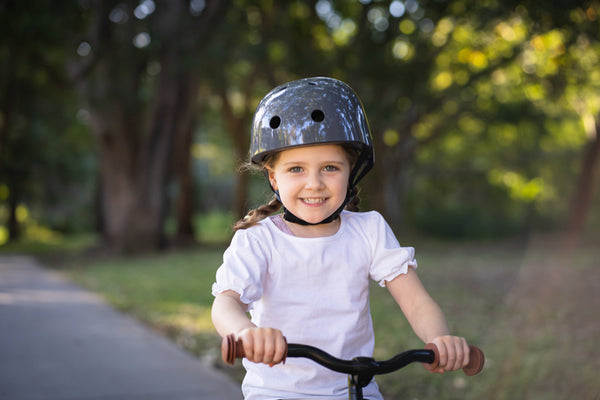 Child wearing a CoCONUTS Grey Helmet - Small