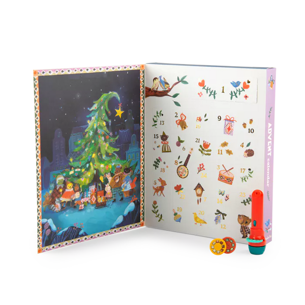 Open Advent Calendar with Christmas-themed illustrations and a torch projector and discs on a white background