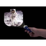 Torch shining astronaut image on the wall