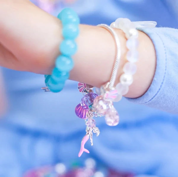 Detail view of child wearing LAUREN HINKLEY Mermaid's Song Charm Bracelet