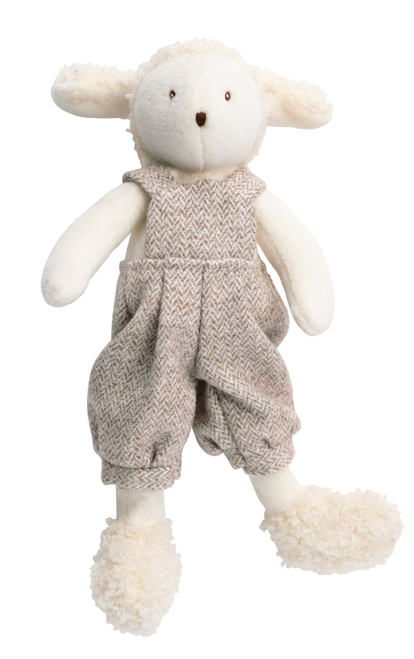 Stuffed toy sheep wearing knitted overalls on a white background