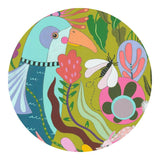 Colourful illustration of a toucan and tropical plants on a circular background
