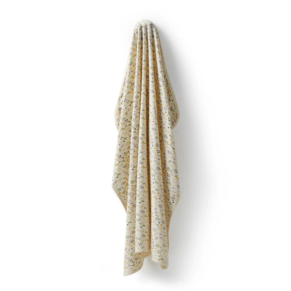 WILSON & FRENCHY Bella Floral Organic Bunny Rug hanging on hook