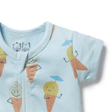 Detail view of baby onesie with ice cream cone design on a light blue background
