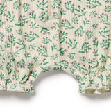 Floral-patterned baby romper on a white background