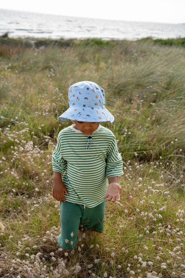 CHILD WEARING ACORN Sea Life Wide Brim Bucket Hat