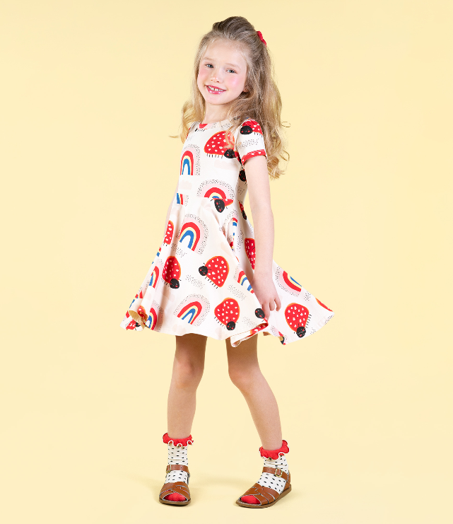 GIRL TWIRLING IN ROCK YOUR BABY Love Bug Rainbow Waisted Dress