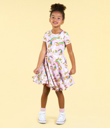 GIRL TWIRLING IN THE ROCK YOUR BABY Unicorn Rainbow Waisted Dress STUDIO SHOT