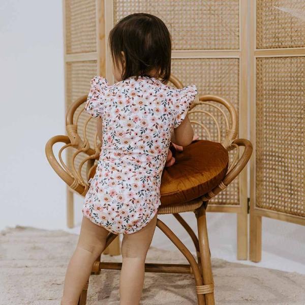 Back view of toddler wearing SNUGGLE HUNNY Spring Floral Short Sleeve Organic Bodysuit