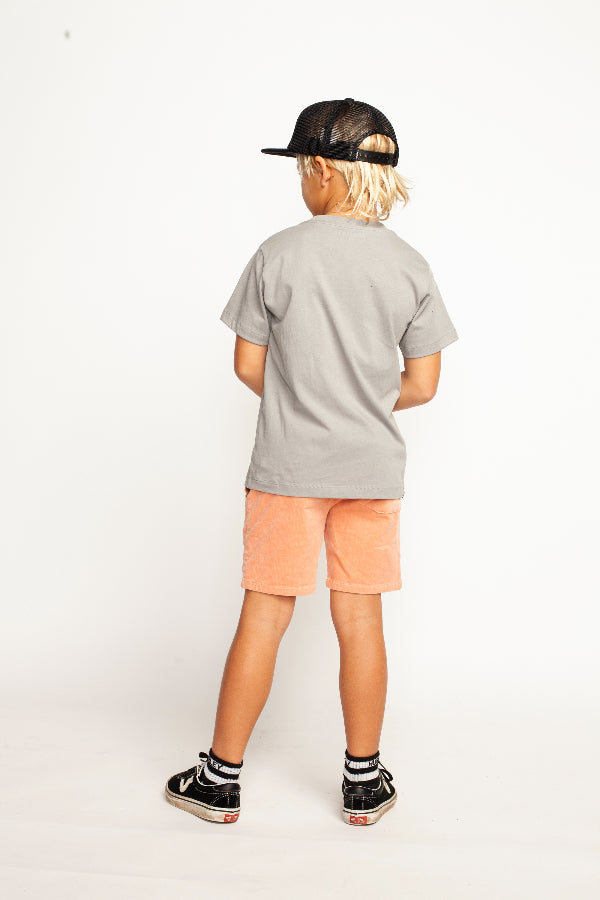 Back view of boy wearing MUNSTER KIDS Oasis SS Tee - Charcoal