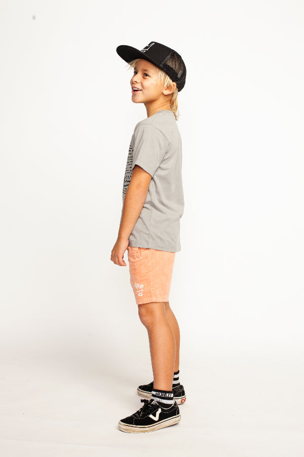 Side view of boy wearing MUNSTER KIDS Oasis SS Tee - Charcoal