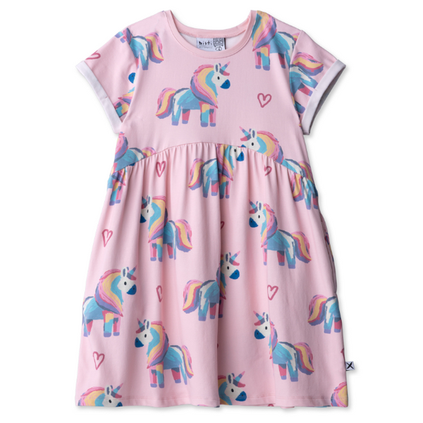 Pink dress with unicorn pattern on a white background