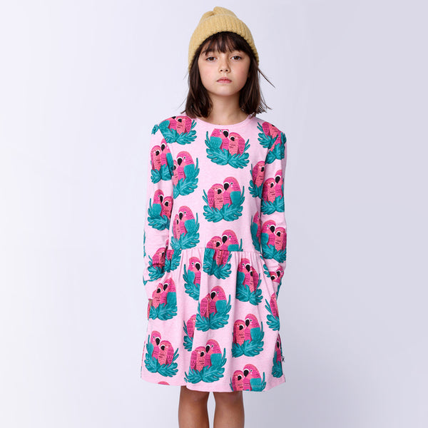 Child standing with hands in pockets of MINTI Parrot Pair Dress