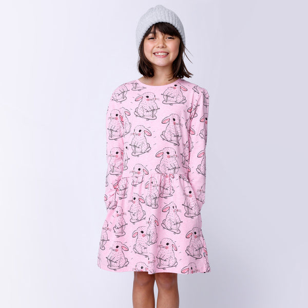Child wearing MINTI Speedy Bunny Dress with hands in side pockets