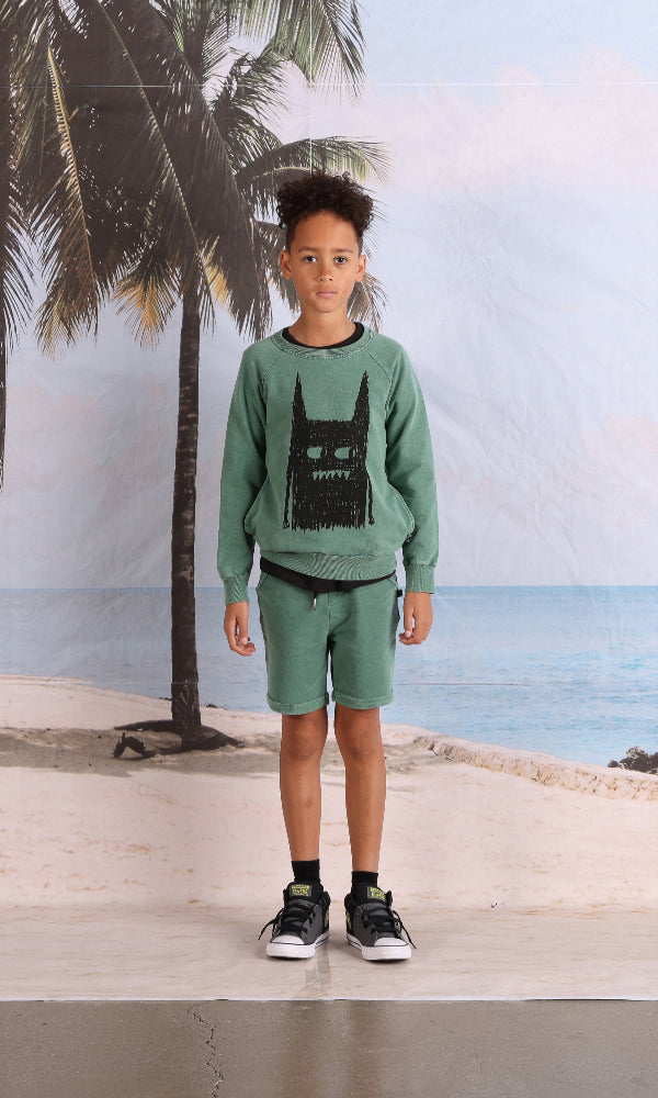 Boy  wearing the MINTI Blasted Ace Short and Scribble Monster Crew